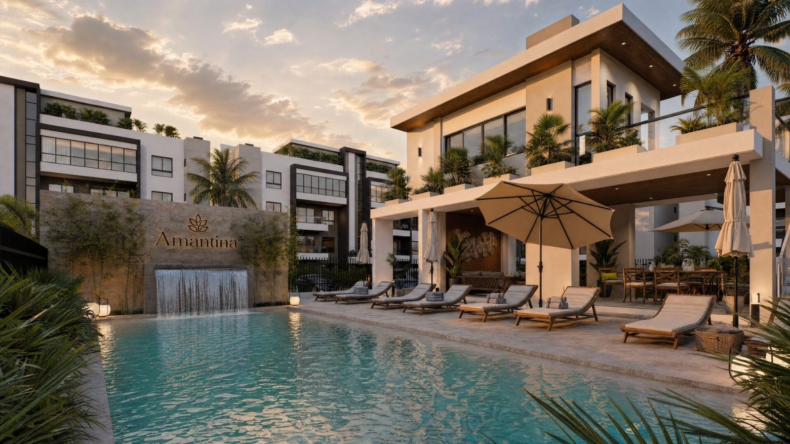 Piscina principal de Amantina Residences con muro de cascada